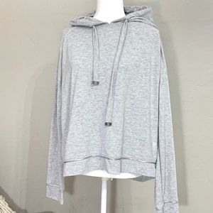 Gray longsleeve top with hood.